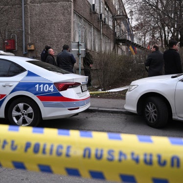 Armenian law enforcement officers stand outside a police station Yerevan on March 24, 2024.