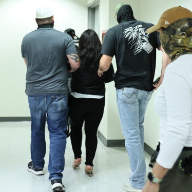 A woman is detained by US federal agents after exiting a court hearing in immigration court at the Jacob K. Javits Federal Building in New York City, on September 3, 2025.