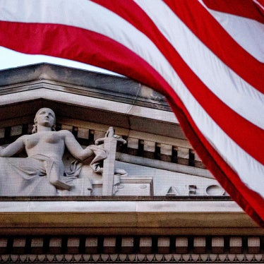 American flag flying outside Department of Justice