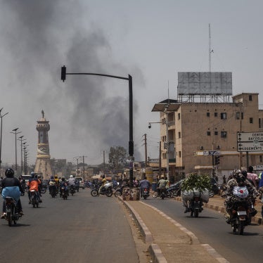 A column of black smoke rises above buildings in Bamako on April 26, 2026.