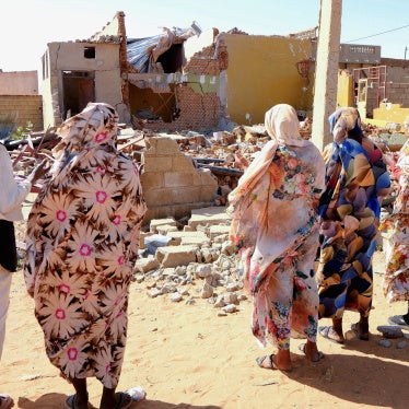 People pray for the victims of a drone strike in El Obeid, North Kordofan State, Sudan, January 12, 2026.