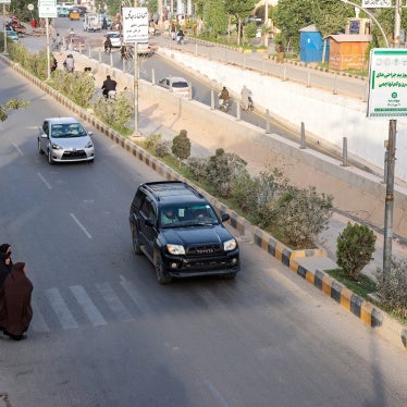 Afghan women walk across a street in Herat on June 8, 2026.