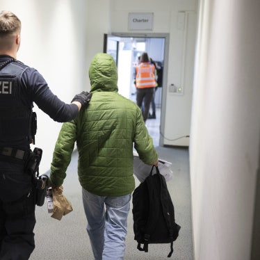 A German police officer takes a man to a deportation flight to Pakistan, February 25, 2025, Hesse, Germany.