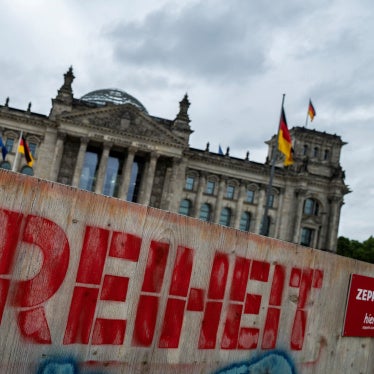 Graffiti on a wooden fence in front of the Reichstag building in Berlin, Germany reads "Freedom," on May 19, 2025.