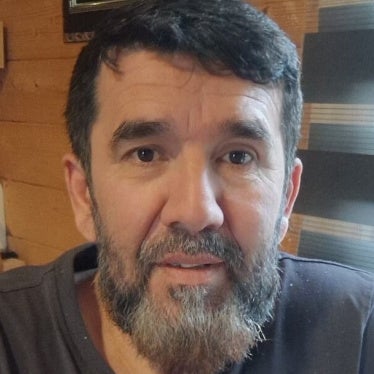 man smiling in a photo