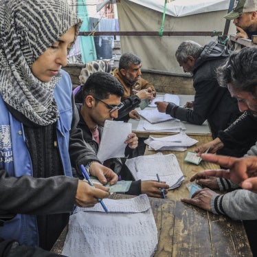 Palestinians receive humanitarian aid from the United Nations Relief and Works Agency for Palestine Refugees in the Near East (UNRWA) in Khan Younis, February 5, 2025. 