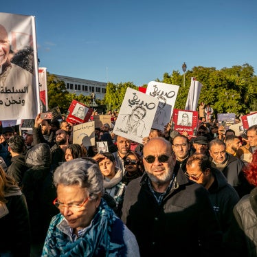 People rally calling for the release of political detainees and greater freedom of expression in Tunis, Tunisia, on December 6, 2025.