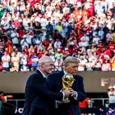Infantino and Trump jointly holding the World Cup Trophy