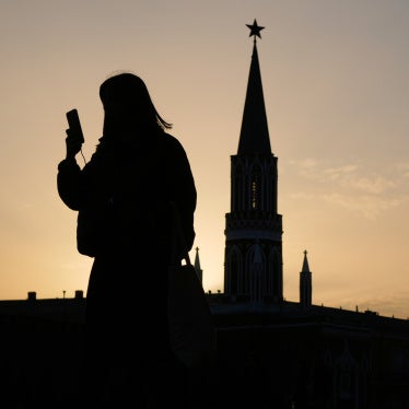  A person checks their phone in the Red Square in Moscow, Russia, March 31, 2026.