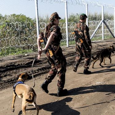 2015-9-eca-hungary-officers-fence