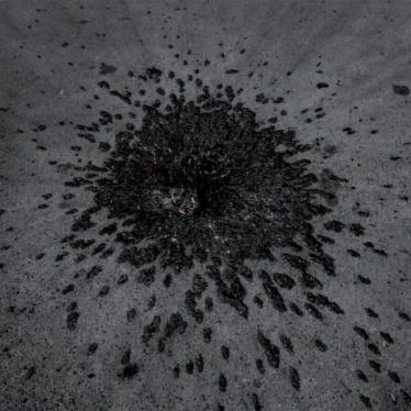 A crater and fragmentation marks consistent with a cluster muntion strike remain five days after an August 12, 2008, attack on the main square of Gori, Georgia. Russia struck the square with an Iskander cluster munition missile, killing six civilians and 