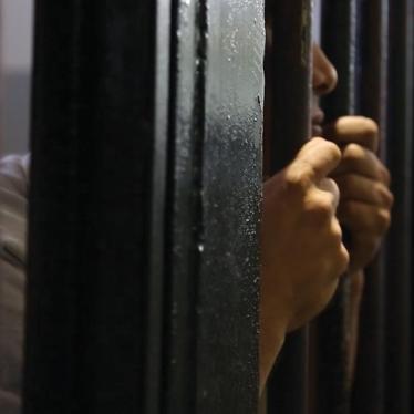 A man behind bars at Sfax detention center; Tunisia, September 26, 2013.