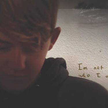 Josh Greer, a student who has been the target of bullying and discrimination in school, writes in his journal in his bedroom in Cache Country, UT, October 2016.