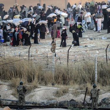 At Tal Abyad –Akçakale border crossing, in June 2015, Turkish border guards manning Turkey’s closed border watched ISIS fighters order displaced Syrian civilians back from the border.