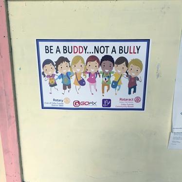 A poster for an anti-bullying campaign hangs on a wall at a secondary school outside Cebu, November 2016. 