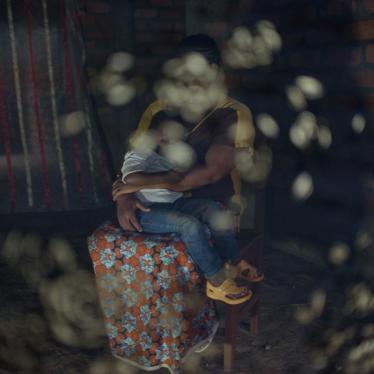 Angèle, 27, holds her child in Bangui. Seleka fighters killed her husband and parents, and later captured her near Bambari in June 2014, she said. They held her in sexual slavery for nine months with five other women and girls. Multiple fighters raped her