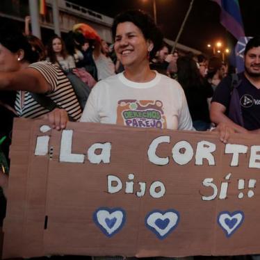 People celebrate after the Inter-American Court of Human Rights called on Costa Rica and Latin America to recognize equal marriage, in San Jose, Costa Rica, January 9, 2018. The sign reads: "The court said yes". 