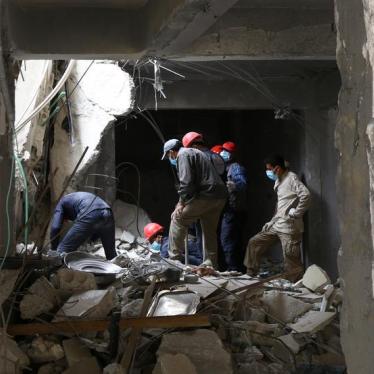 Rescue workers search for bodies still trapped under mounds of debris in Raqqa, Syria April 9, 2018. 
