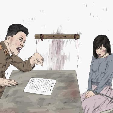 Woman being questioned by a secret police investigator. Former detainees say that secret police investigators can easily harass female detainees during questioning.