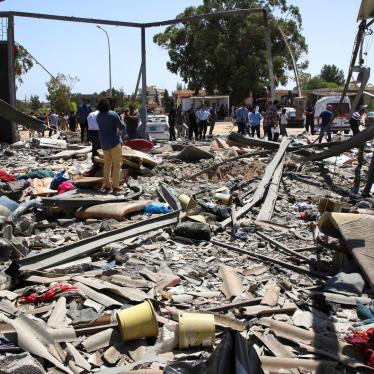 Debris covers the ground after an airstrike on the Tajoura migrant detention center in Tajoura east of Tripoli in Libya where 53 migrants were killed, Wednesday, July 3, 2019. 