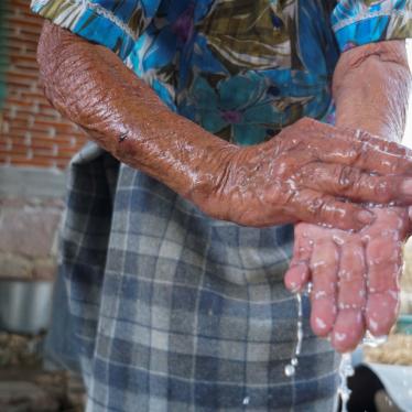 A Zapotec woman washes her hands after learning from a local radio program about hand-washing and social distancing to avoid COVID-19, in Oaxaca state, Mexico, March 31, 2020. 